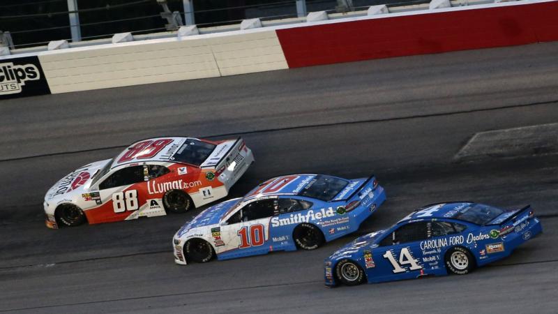 Alex Bowman, driver of the No. 88 LLumar Chevrolet, leads Aric Almirola, driver of the No. 10 Smithfield Helping Hungry Homes Ford, and Clint Bowyer, driver of the No. 14 Carolina Ford Dealers Ford, during the Monster Energy NASCAR Cup Series.