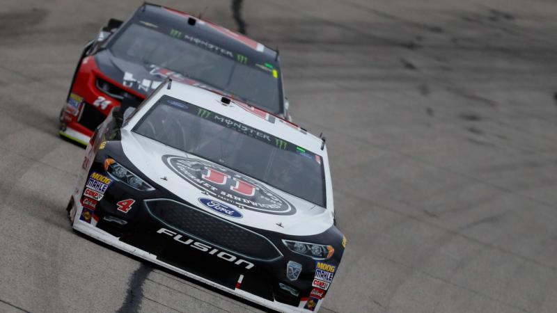 Kevin Harvick, driver of the #4 Jimmy John's Ford, passes William Byron, driver of the #24 Liberty University Chevrolet, during the Monster Energy NASCAR Cup Series Folds of Honor QuikTrip 500 at Atlanta Motor Speedway on February 25, 2018 in Hampton, Georgia.