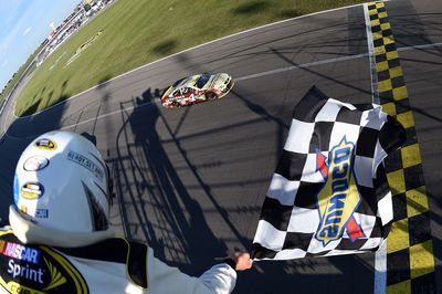 Kevin Harvick locked himself into the third round of NASCAR's Chase by winning at Kansas Speedway. 