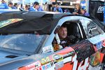 Tony Stewart gets strapped in before qualifying at BMS.