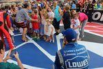 Jimmie Johnson looks on as his girls get set to sign the National Anthem.