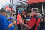 Brett McMillan at the O'Reilly Auto Parts display with fans.
